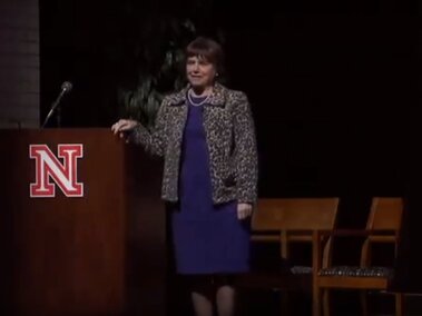 Catherine Bertini on stage during her lecture.