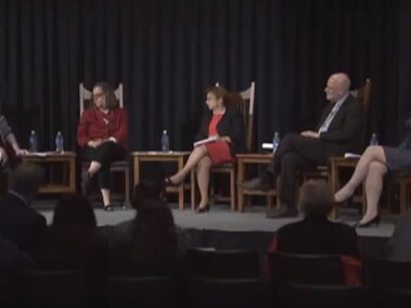 Dr. Chris Elias, Dr. Joan Lombardi, Dr. Nurper Ulkuer on stage during their lecture.